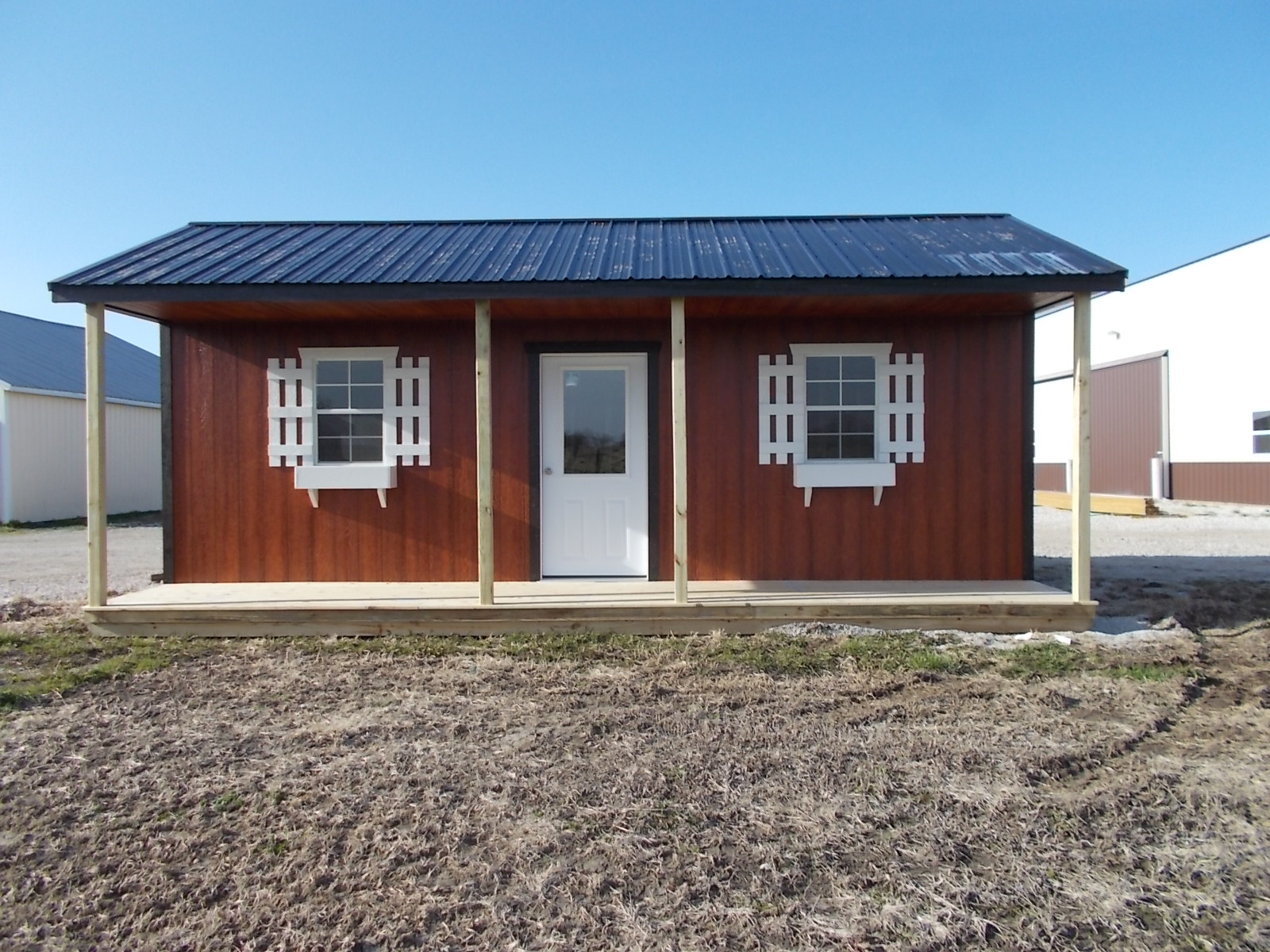 wood building with covered porch